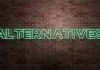 ALTERNATIVES - fluorescent Neon tube Sign on brickwork - Front view - 3D rendered royalty free stock picture | AltCoin is just a fancy name for Alternative Cryptos, BitcoinGlossary.org